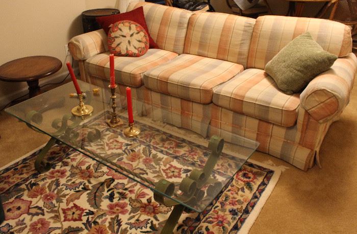 Sofa, rug and glass coffee table