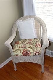 we have two of these wicker chairs.  Sweet for a sun room, covered porch or guest room