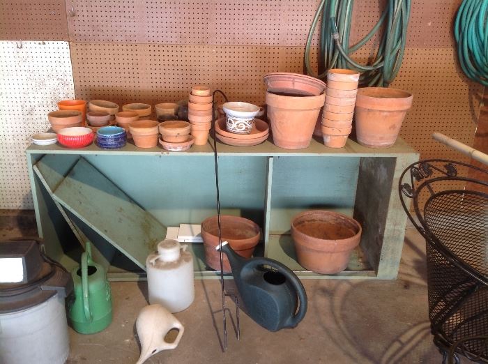 Clay pots and watering cans
