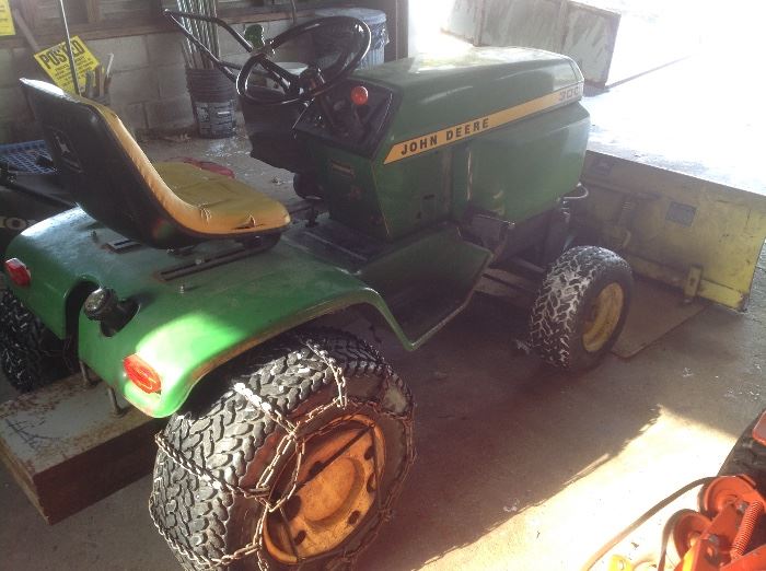 John Deere 300 with lawn mower and blade.  Chains and weights on tires.  $1200
