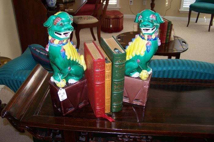 Pair of foo dogs with leather books -