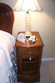 One of a pair of mahogany nightstands