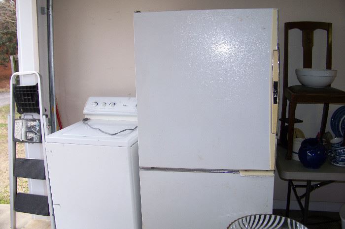 Refrigerator in the garage - as well as a Maytag washer - in the garage
