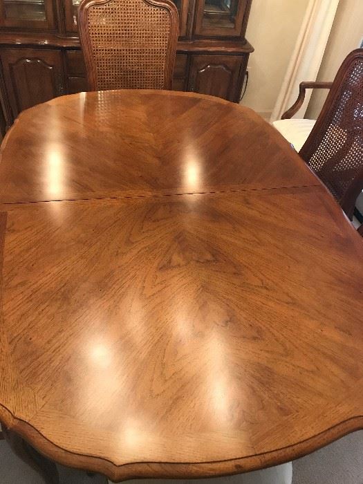 Thomasville - French Provincial - Pecan finish - 2 table leaves with custom pads.  2-End Chairs 6-Side Chairs made of wood with Pecan finish, with cane backing to chair and fabric seat cushions