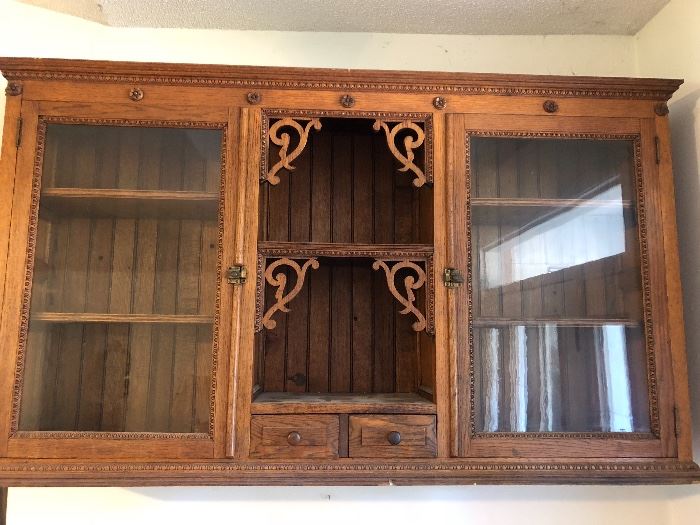 Antique cabinet with beautiful wood detail work 