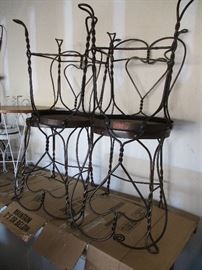 Original wrought iron bar stools with wooden seats