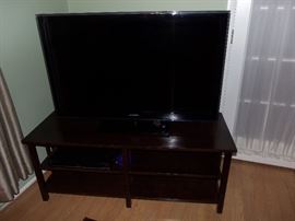 Samsung flat screen TV on entertainment cabinet