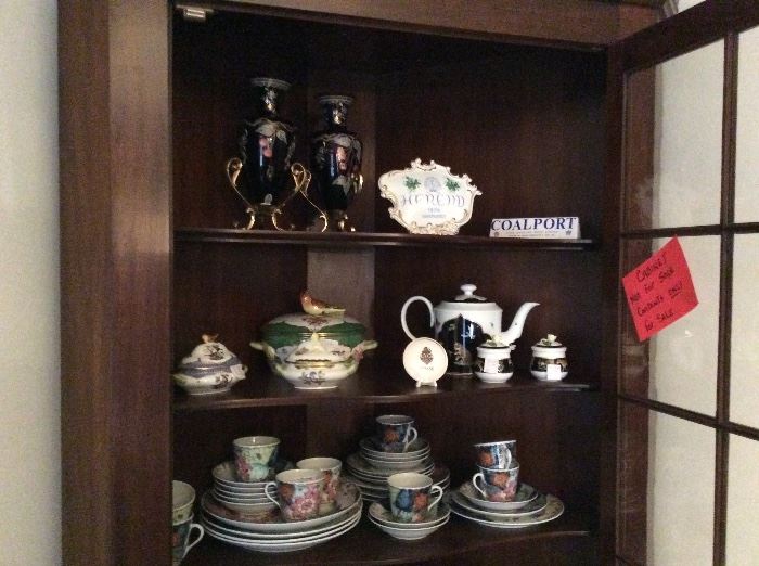 Look at the gorgeous Fenton vases on the top shelf!