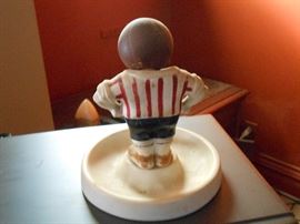 Back of bobblehead figure