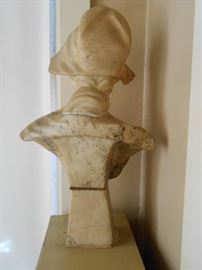 Bust is sitting cardboard between base and bust