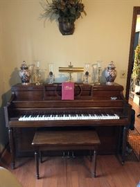 piano, wall floral arrangement, oriental ginger jars, reading lamp, 