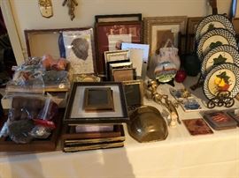 picture frames, plates in holder, brass wall pot, coasters