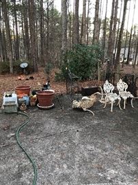 flower pots, bakers rack, cast iron bench, 2 chairs, and sm table, concrete pots