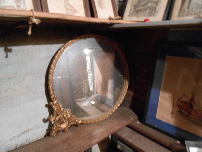 We have 2 of these round ornate mirrors