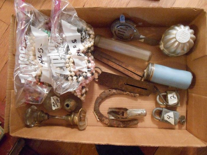 Bead necklaces, vintage door handles, locks, portable scale