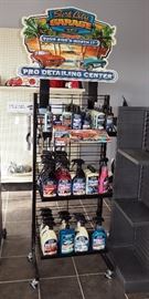 SURF CITY GARAGE ROLLING DISPLAY RACK AND CONTENTS INCLUDES GLASS CLEANER, WAX DETAILER, TIRE DRESSING, KILLER CHROME AND MORE