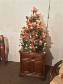 Pre-lit poinsettia Christmas tree and Stanley side table