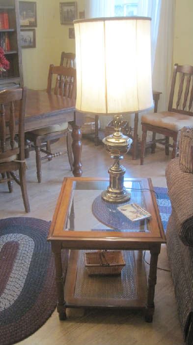 Glass top end table, large brass lamp (one of a pair) 