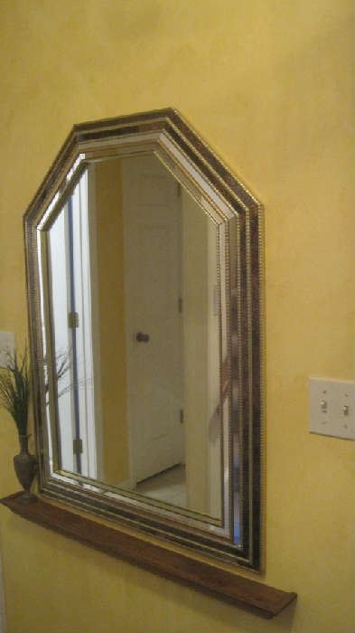  Glass wall mirror with narrow shelf