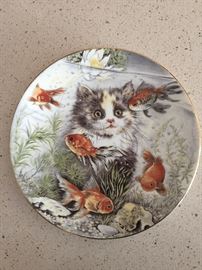 Kitten looking at gold fish - plate