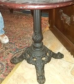 Round table has heavy cast iron base