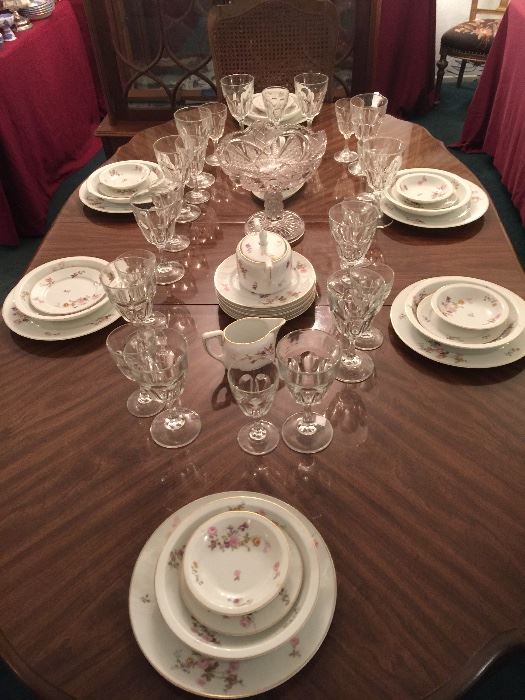 Six place settings of fine China, plus some serving pieces. 12 Water, 11 wine crystal goblets