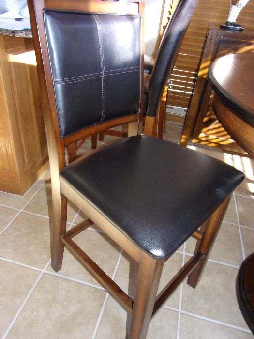 1 year old Round pub height table and unique pedestal with four pub height chairs and buffet