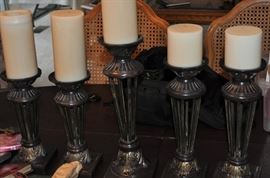 Metal candlesticks, various sizes