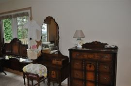 1920s antique walnut bedroom set including head/footboard tall dresser vanity and vanity stool, vintage baby items, granny square vintage crocheted spread, lamps