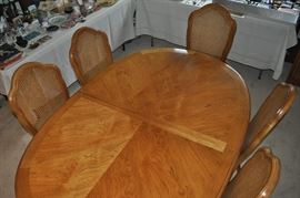 Thomasville dining room set with 6 caned back upholstered seat chairs and 2 leaves from Greenbaum