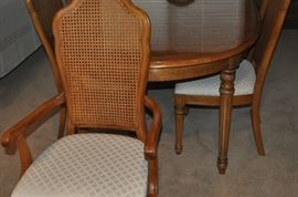 Thomasville dining room set with 6 caned back upholstered seat chairs and 2 leaves from Greenbaum