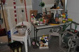 Gardening tools, hose and hose reel, potting supplies, yard art, potting soil, pots, and more