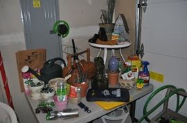 Gardening tools, hose and hose reel, potting supplies, yard art, potting soil, pots, and more
