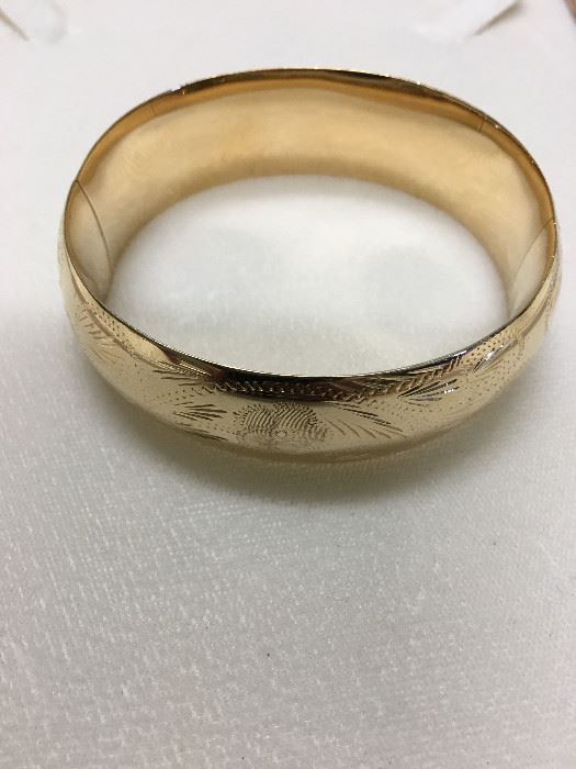 This 14kt gold bangle bracelet is like new and is 20.5mm and weighs almost 30 grams.  