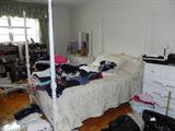 WHITE POSTER CANOPIED BED AND MATCHING DRESSER (PARTIALLY HIDDEN BY MORE CLOTHING)