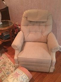 Off white rocker/recliner. Great for a small space!  Also notice the view of the large, room sized oriental and the occasional table in the background.