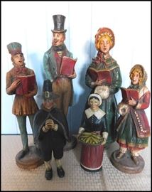 Dickens carolers plus two pilgrims decorative figurines