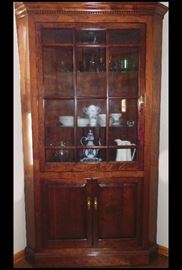 One of two custom built large solid cherry corner china cabinets