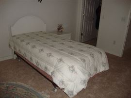 1 twin bed with wood headboard