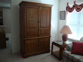 Oak Armoire with rectractible doors.  Will accommodate 42" TV