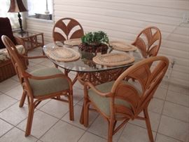 Lanai or kitchen set. Cane table with glass top, 4 chairs with upholstered seats (like new condition)