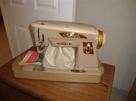 Older Singer sewing machine with case