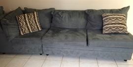 2 Year old Blue Microfiber Sectional with Decorative Pillows.