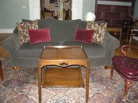 Gray upholstered Loveseat with cushions