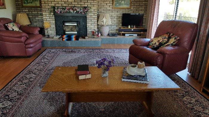 Huge beautiful wool area rug, oak furniture and leather seating