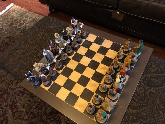 Hand painted chess set with pilgram and native american motif. 