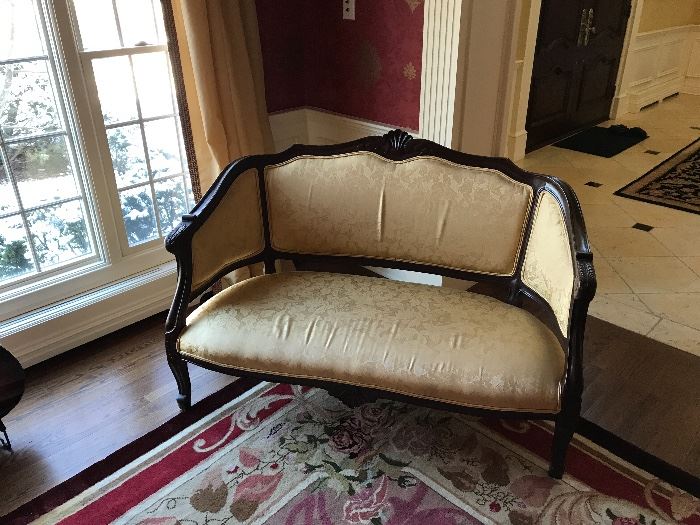 Andre originals love seat with tan upholstery. 