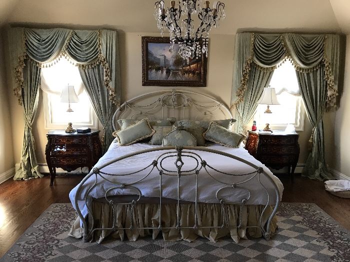 Master bedroom wide shot. Hand painted metal bed frame - king. Pair of french marble top commodes.