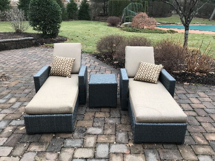 Pair of Sunbrella chaise lounges.