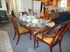 nice Dining Table with 4 matching chairs + Dish sets